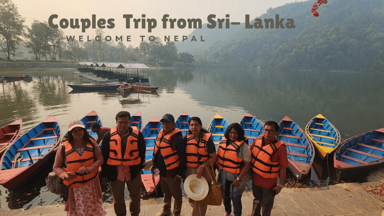 Sri Lankan Couple tourists enjoying the boating on Phewa Lake in Pokhara.